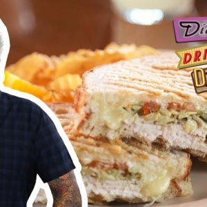 Guy Fieri Eats a Turkey Artichoke Panini | Diners, Drive-Ins and Dives | Food Network
