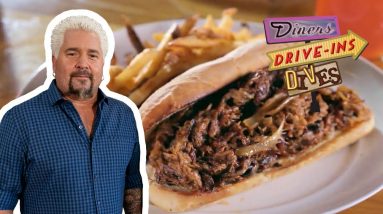 Guy Fieri Eats the Three-Meat Octavian Sandwich | Diners, Drive-Ins and Dives | Food Network