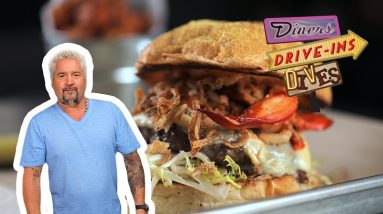 Guy Fieri Eats a Surf 'n' Turf Burger | Diners, Drive-Ins and Dives | Food Network