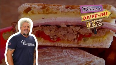 Guy Fieri Eats a Cuban-Style Sandwich at the Pit Stop | Diners, Drive-Ins and Dives | Food Network