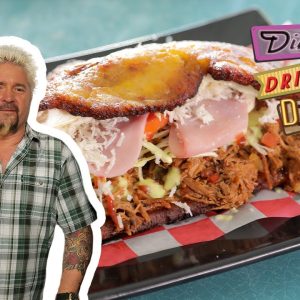 Guy Fieri Eats a Patacon Beef Sandwich | Diners, Drive-Ins and Dives | Food Network