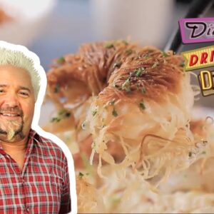 Guy Fieri Eats Kataifi Fried Shrimp & Greek-Style Grits | Diners, Drive-Ins and Dives | Food Network