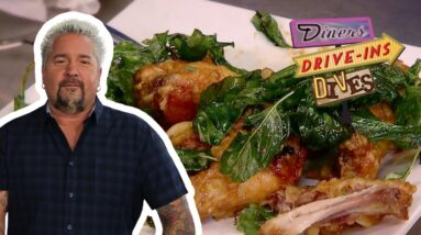 Guy Fieri Eats EXTRA-Garlicky Spicy Thai Chicken Wings | Diners, Drive-Ins and Dives | Food Network