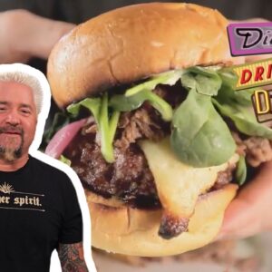 Guy Fieri Eats a Massive Lamb-Topped Burger | Diners, Drive-Ins and Dives | Food Network