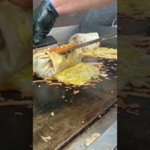 Cheese-Crusted Burrito |📍: @breadandbreakfastla | Food Network
