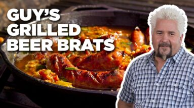 Guy Fieri's Grilled Beer Brats with Peppers and Onions | Guy's Big Bite | Food Network